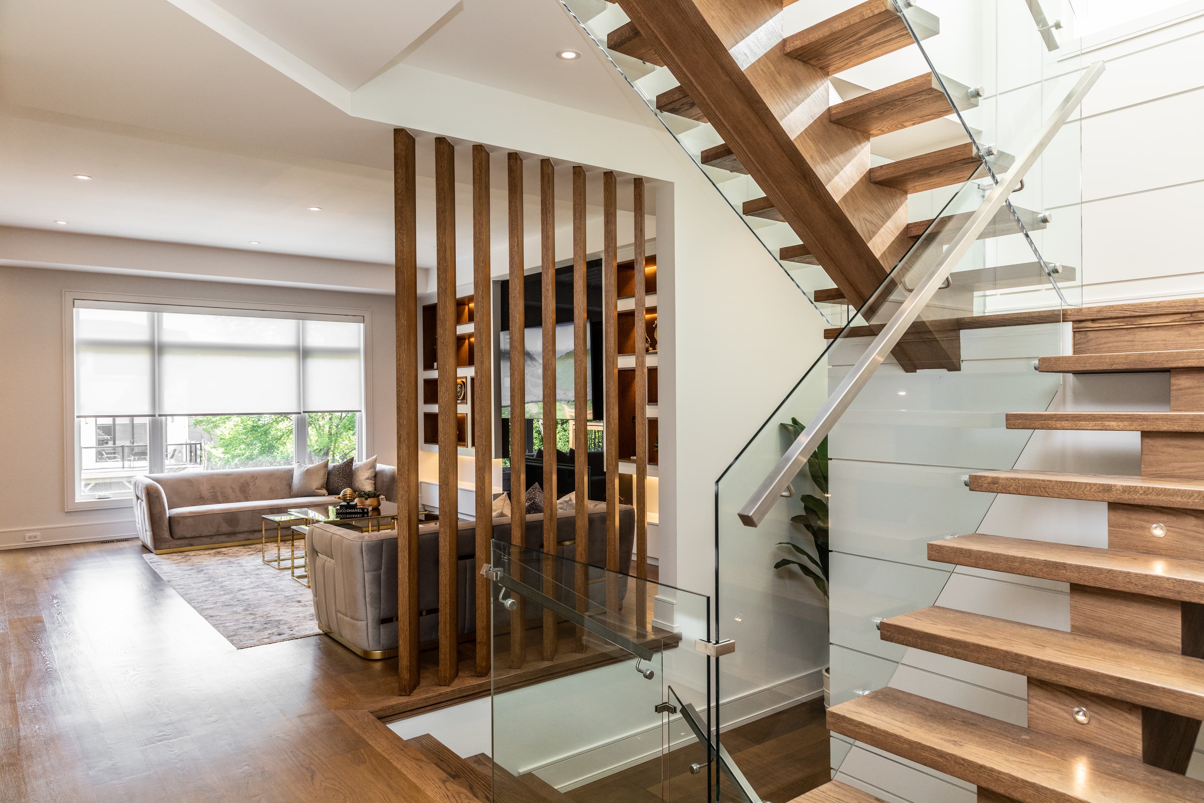 Terrace, floating walnut staircase with glass railing